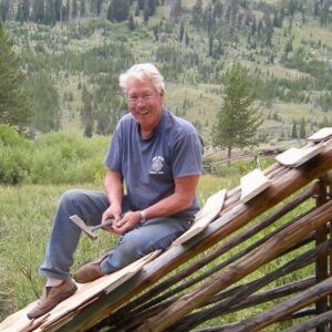 John Mutter repairing a roof in the backcountry